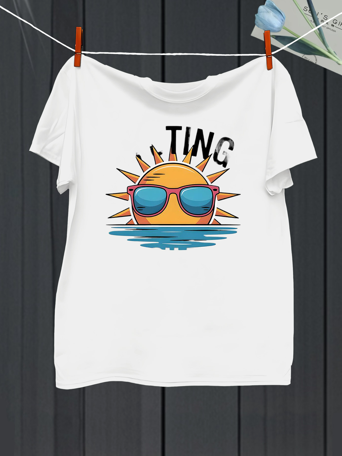 Men's Graphic T-Shirt Ting Vibrant Sun Wearing Sunglasses Over Reflective Water Surface