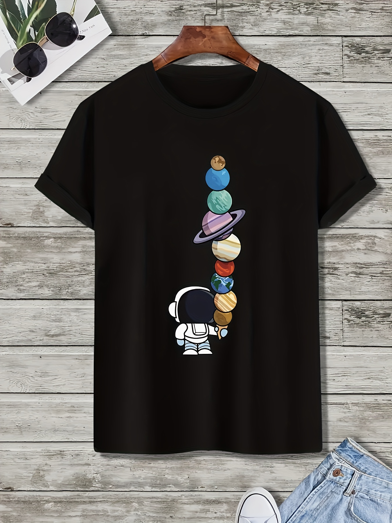 Men's Graphic T-Shirt Playful Astronaut Balancing Colorful Planets In Outer Space