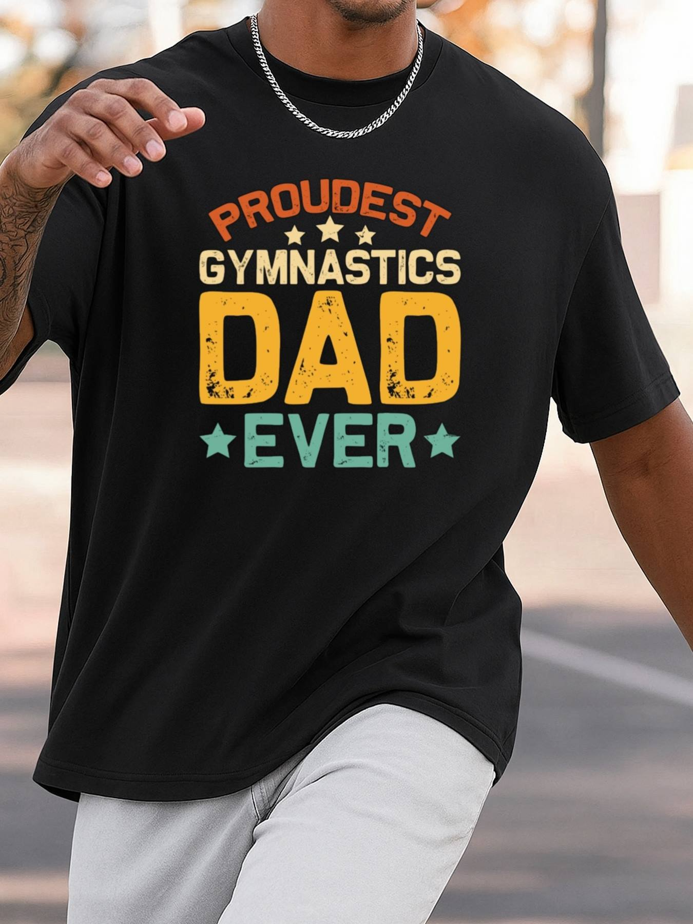 Men's Graphic T-Shirt Proudest Gymnastics Dad Ever Bold Text With Colorful Accents On Black T Shirt