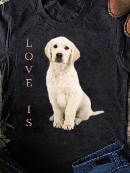 Men's Graphic T-Shirt Love Is Cream Colored Puppy Sitting Under Soft Lighting Dog